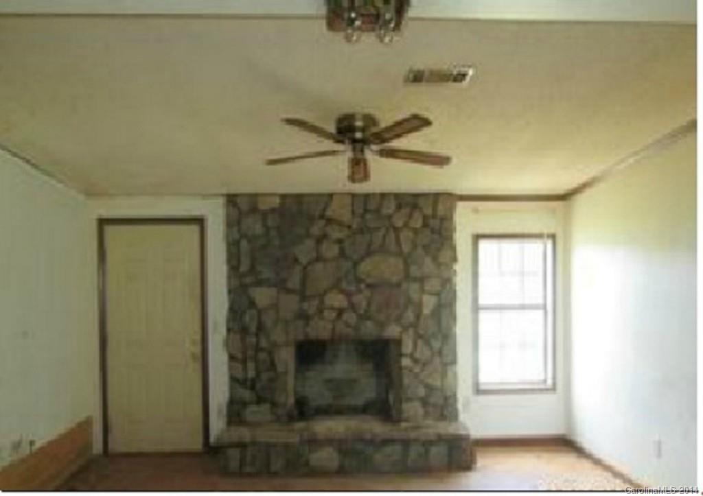 3637 Mt Pleasant Road South Concord, NC 28025 - Photo 4 of 7 a view of a livingroom with a fireplace and a window