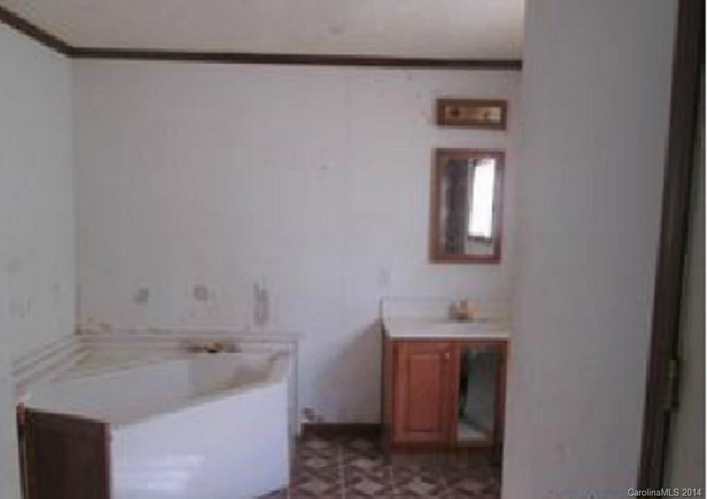 3637 Mt Pleasant Road South Concord, NC 28025 - Photo 7 of 7 a bathroom with a sink and a mirror