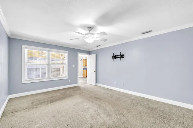 a kitchen with stainless steel appliances granite countertop a refrigerator a sink dishwasher a stove and white countertops with wooden floor