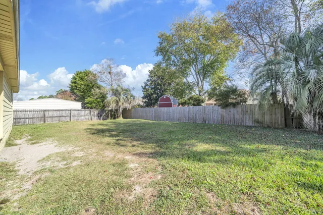 a view of a backyard with a bird bath