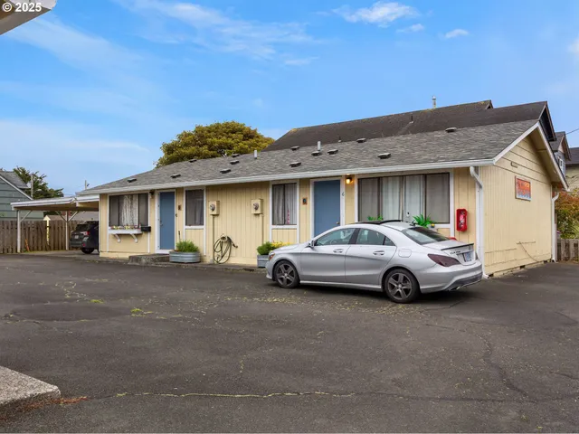 a view of a car park in front of house