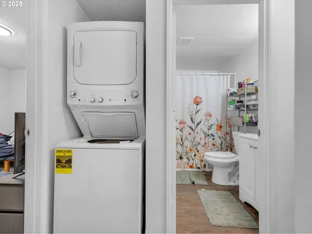 a bathroom with a sink toilet and shower curtain