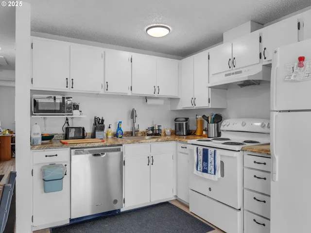 a bed room with a bed and a cabinets