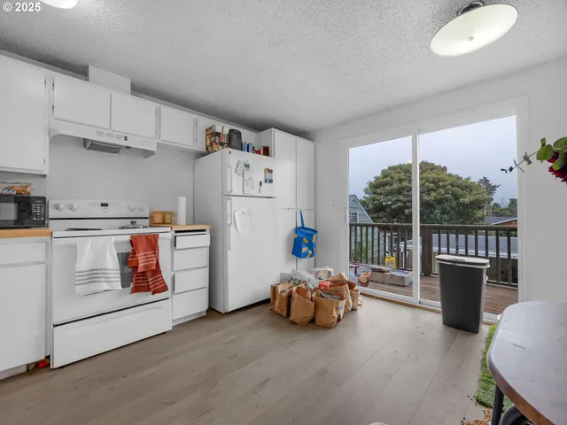 a living room with furniture and a bookshelf
