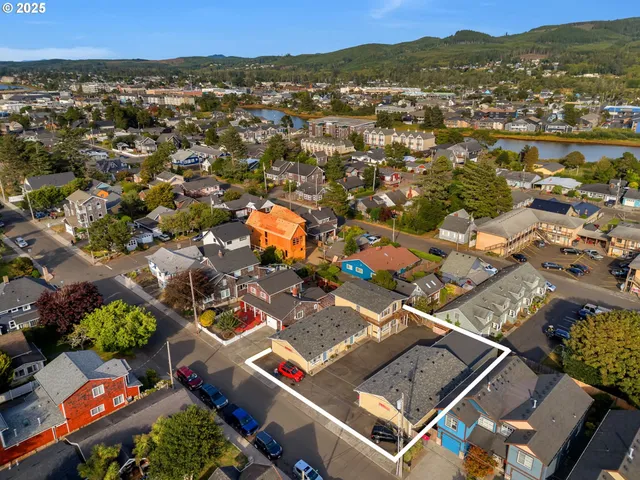 an aerial view of residential houses with outdoor space