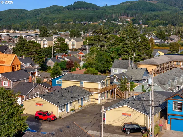 an aerial view of residential houses and outdoor space
