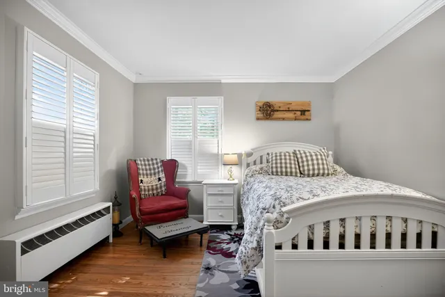 a bedroom with furniture and windows