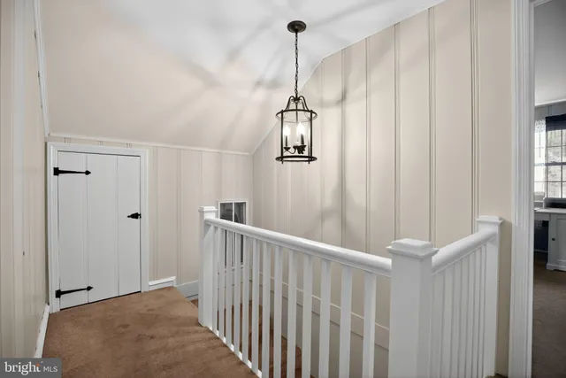 a view of a hallway with windows