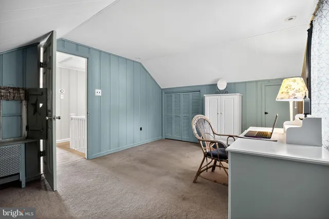 a workspace with furniture and a lamp