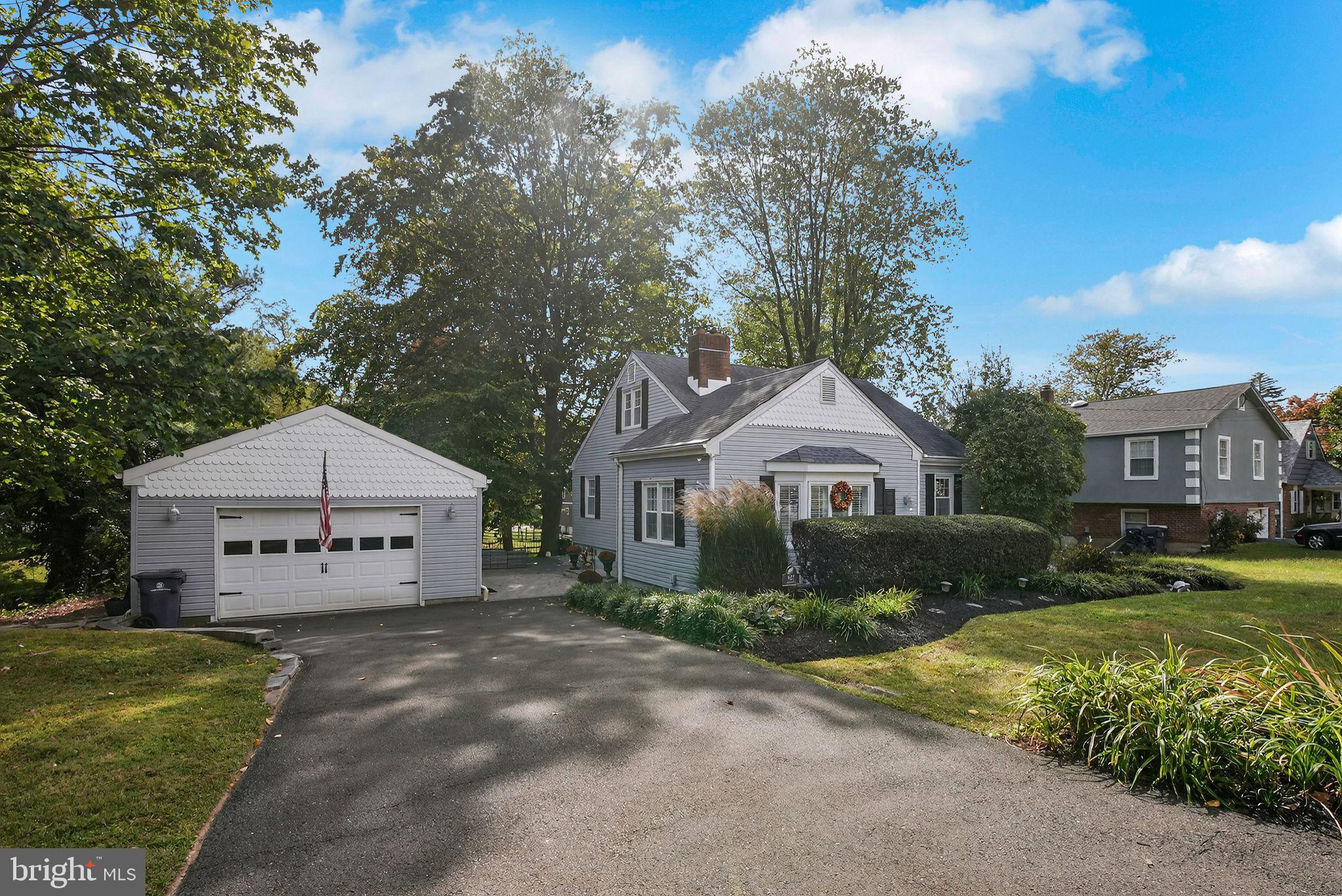 927 Sherman Avenue Huntingdon Valley, PA 19006 - Photo 2 of 29 a front view of a house with garden