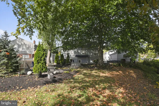 a view of a house with a tree
