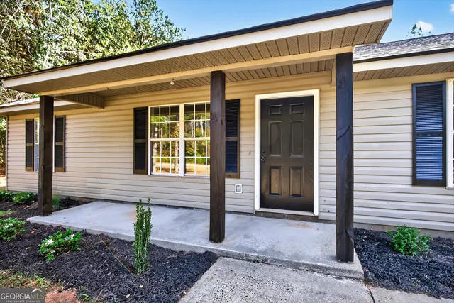 a front view of a house with a porch
