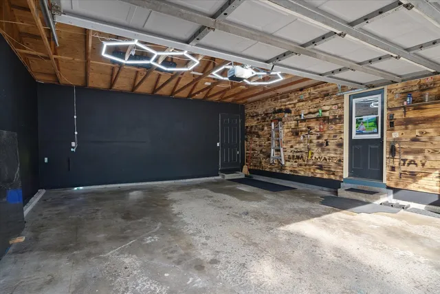 swimming pool with lawn chairs and plants