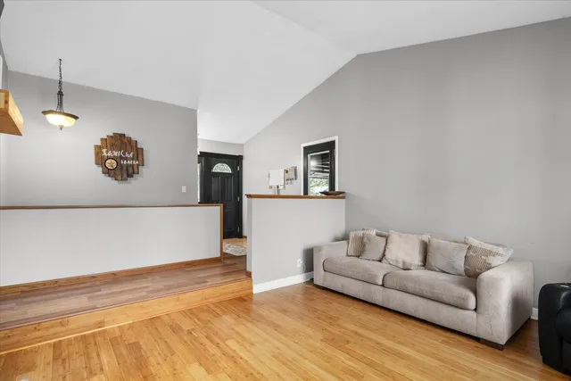 a kitchen with stainless steel appliances granite countertop a refrigerator a stove top oven a sink and dishwasher