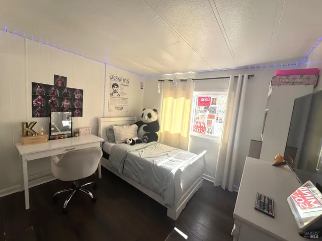 a bedroom with a bed and furniture