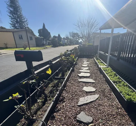 a view of a house with backyard and wooden floor