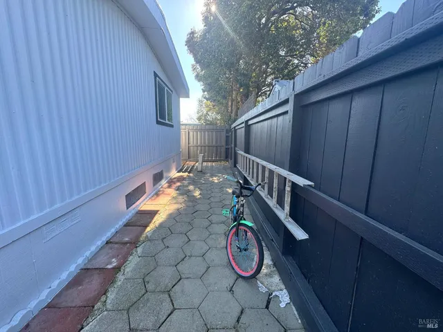 a view of a deck with wooden fence and floor