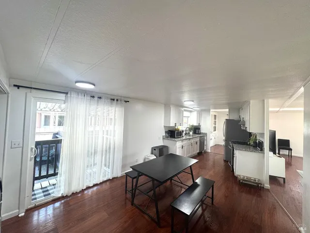 a workspace with furniture window and wooden floor