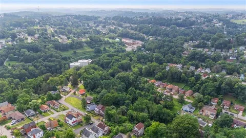 an aerial view of a city and mountain view in a city