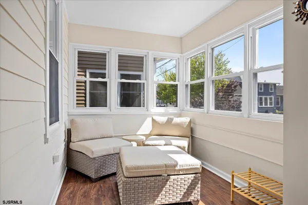 a living room with furniture and windows