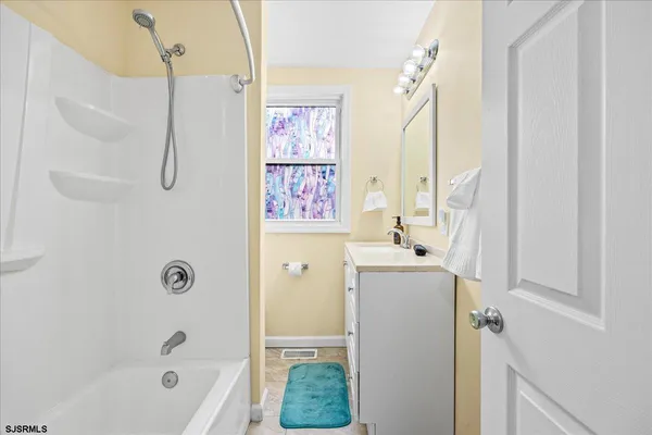 a bathroom with a bath tub and a shower