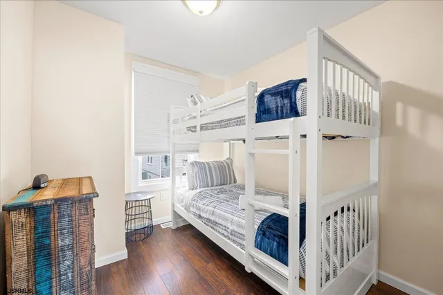 a bedroom with furniture and baby crib