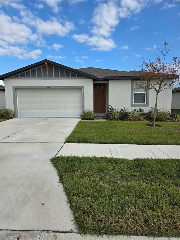 3408 Bonsilva Street Plant City, FL 33566 - Photo 1 of 1 a front view of a house with a yard and garage