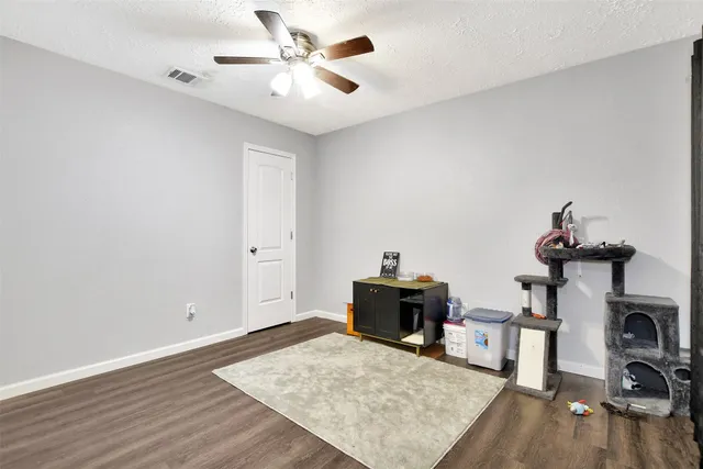 a view of livingroom with hardwood floor and a ceiling fan