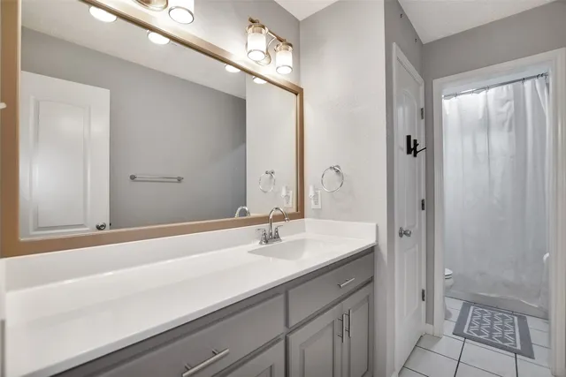 a bathroom with a sink double vanity and a mirror