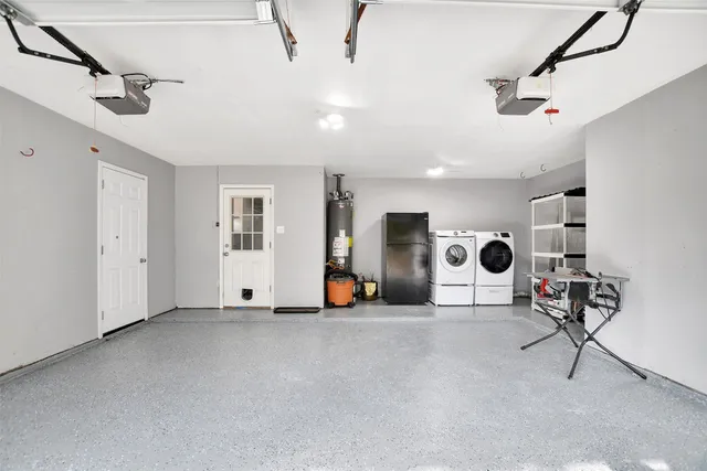 a view of a livingroom with couch and a ceiling fan