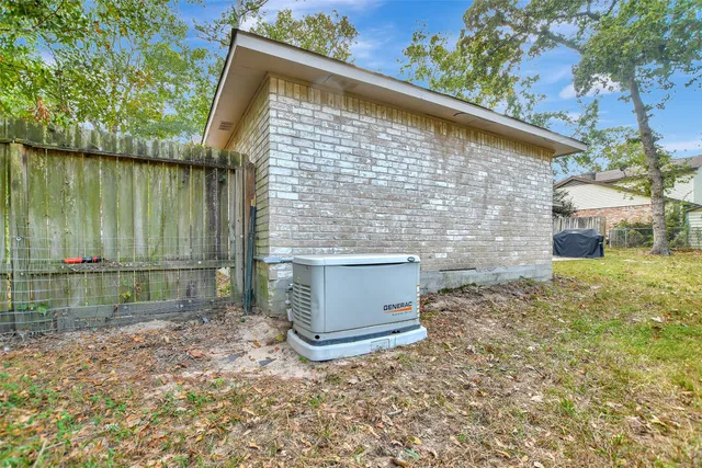 a backyard of a house with a yard and outdoor seating