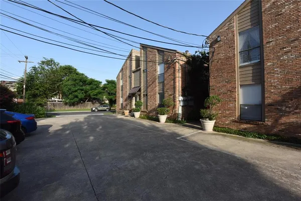 a view of a street with a building in the background