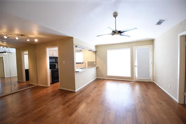 a view of a kitchen with a sink and a window