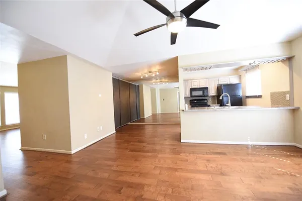 a view of a kitchen with a sink and cabinets