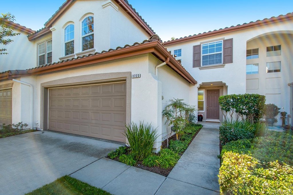 1723 Bluebird Lane Carlsbad, CA 92011 - Photo 1 of 33 a front view of a house with garden