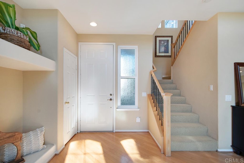 1723 Bluebird Lane Carlsbad, CA 92011 - Photo 14 of 33 a view of entryway with furniture and wooden floor
