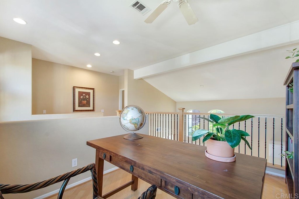 1723 Bluebird Lane Carlsbad, CA 92011 - Photo 16 of 33 a view of a dining room with furniture and wooden floor
