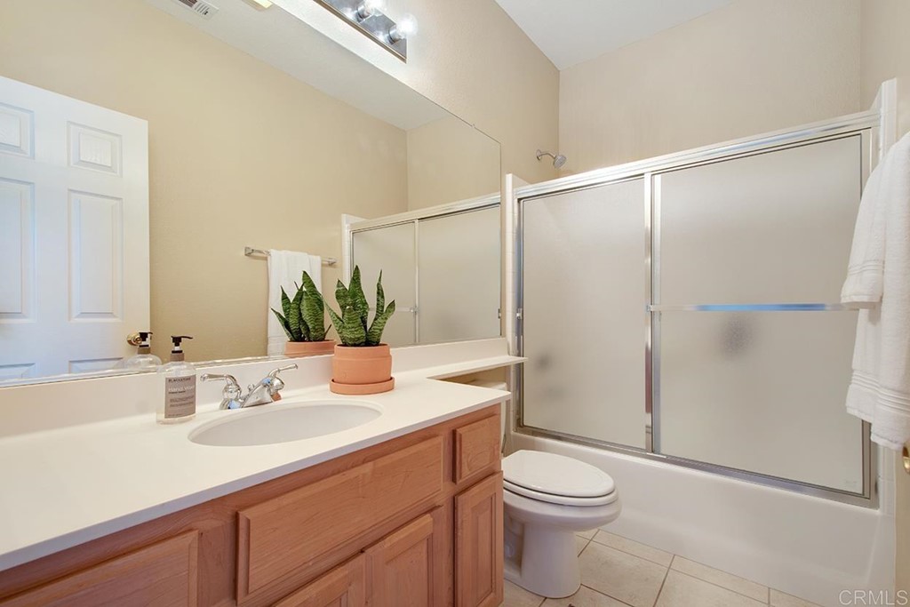 1723 Bluebird Lane Carlsbad, CA 92011 - Photo 24 of 33 a bathroom with a sink a toilet and shower