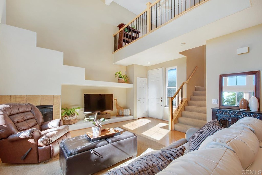 1723 Bluebird Lane Carlsbad, CA 92011 - Photo 4 of 33 a living room with furniture and a flat screen tv