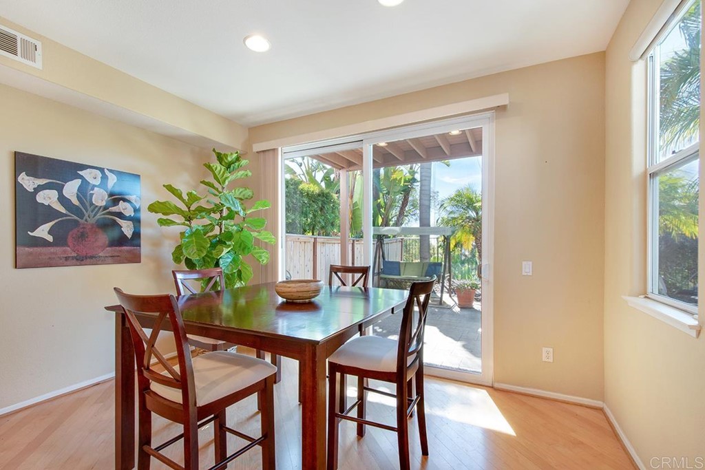 1723 Bluebird Lane Carlsbad, CA 92011 - Photo 6 of 33 a view of a dining room with furniture large window and wooden floor