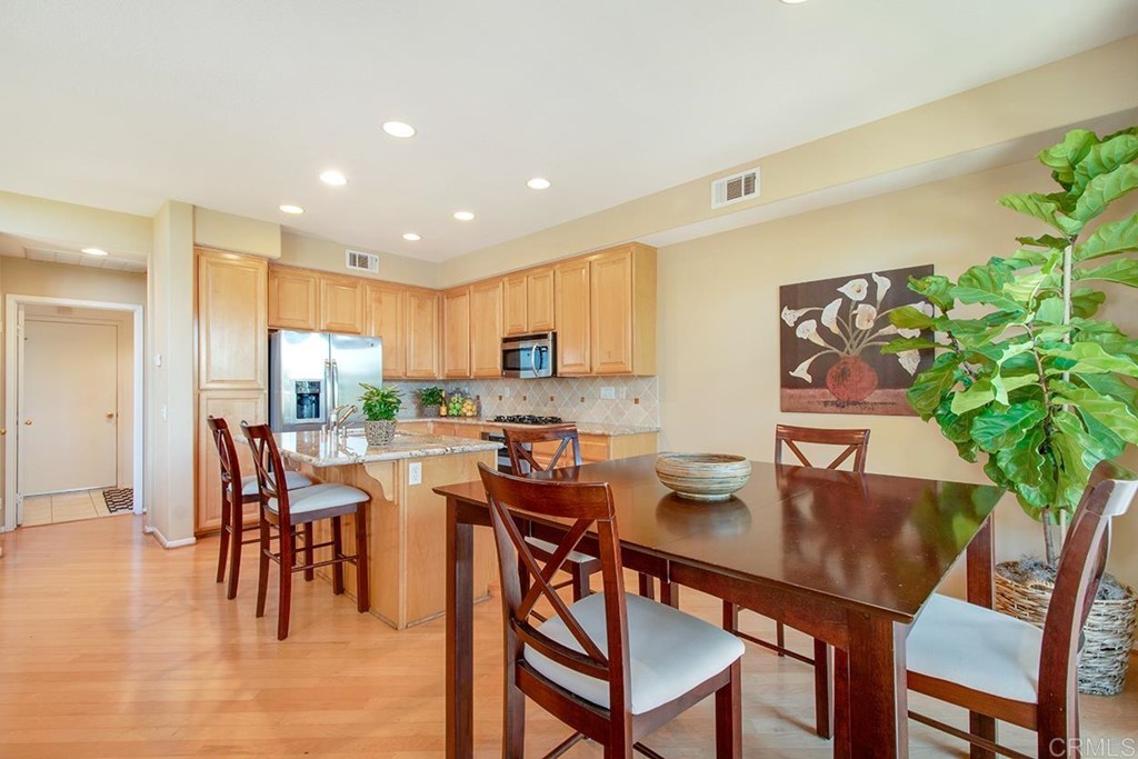 1723 Bluebird Lane Carlsbad, CA 92011 - Photo 7 of 33 a view of a dining room with furniture and wooden floor