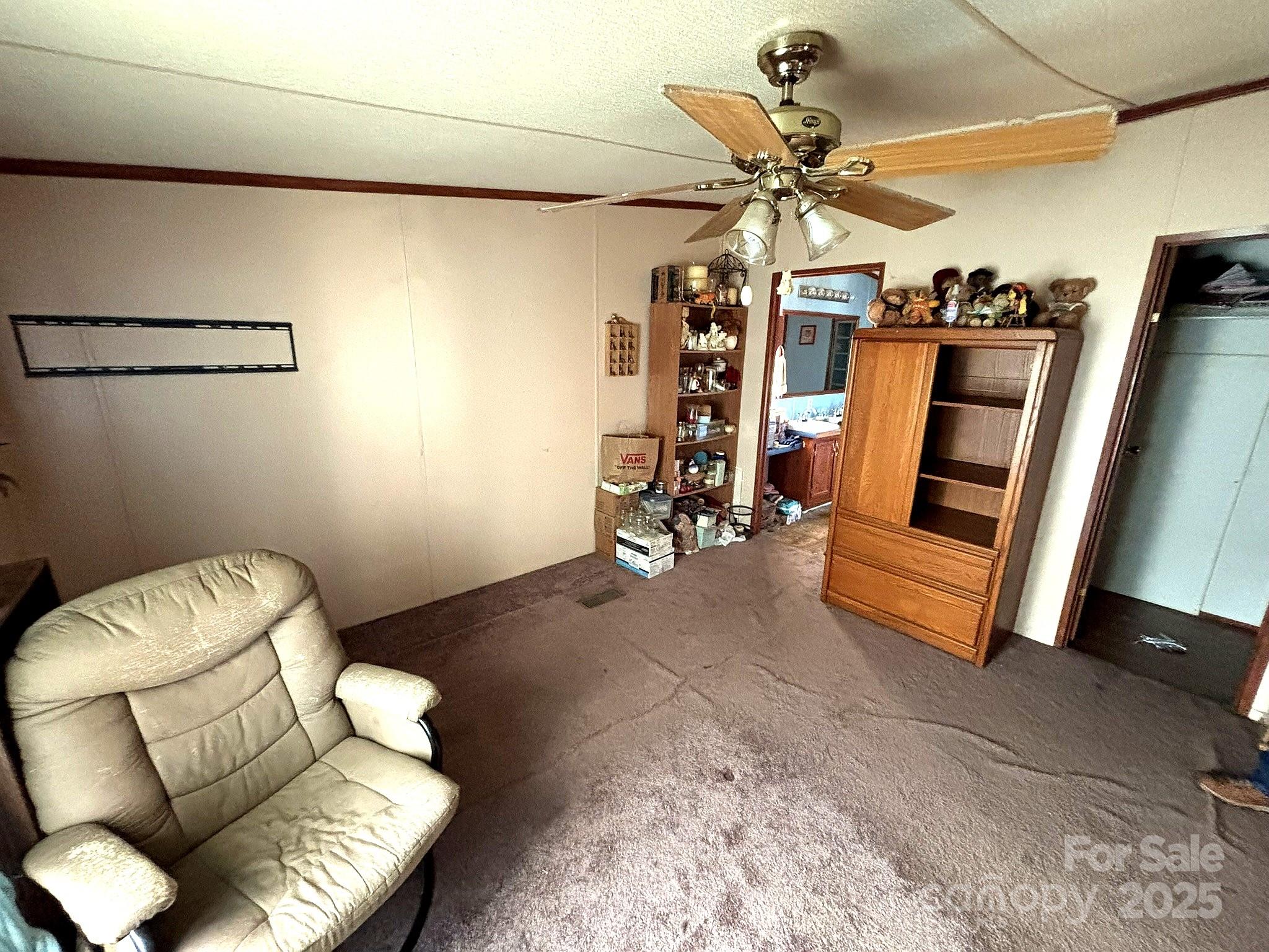 212 South Upright Street Landis, NC 28088 - Photo 18 of 21 a view of a livingroom with furniture and a ceiling fan