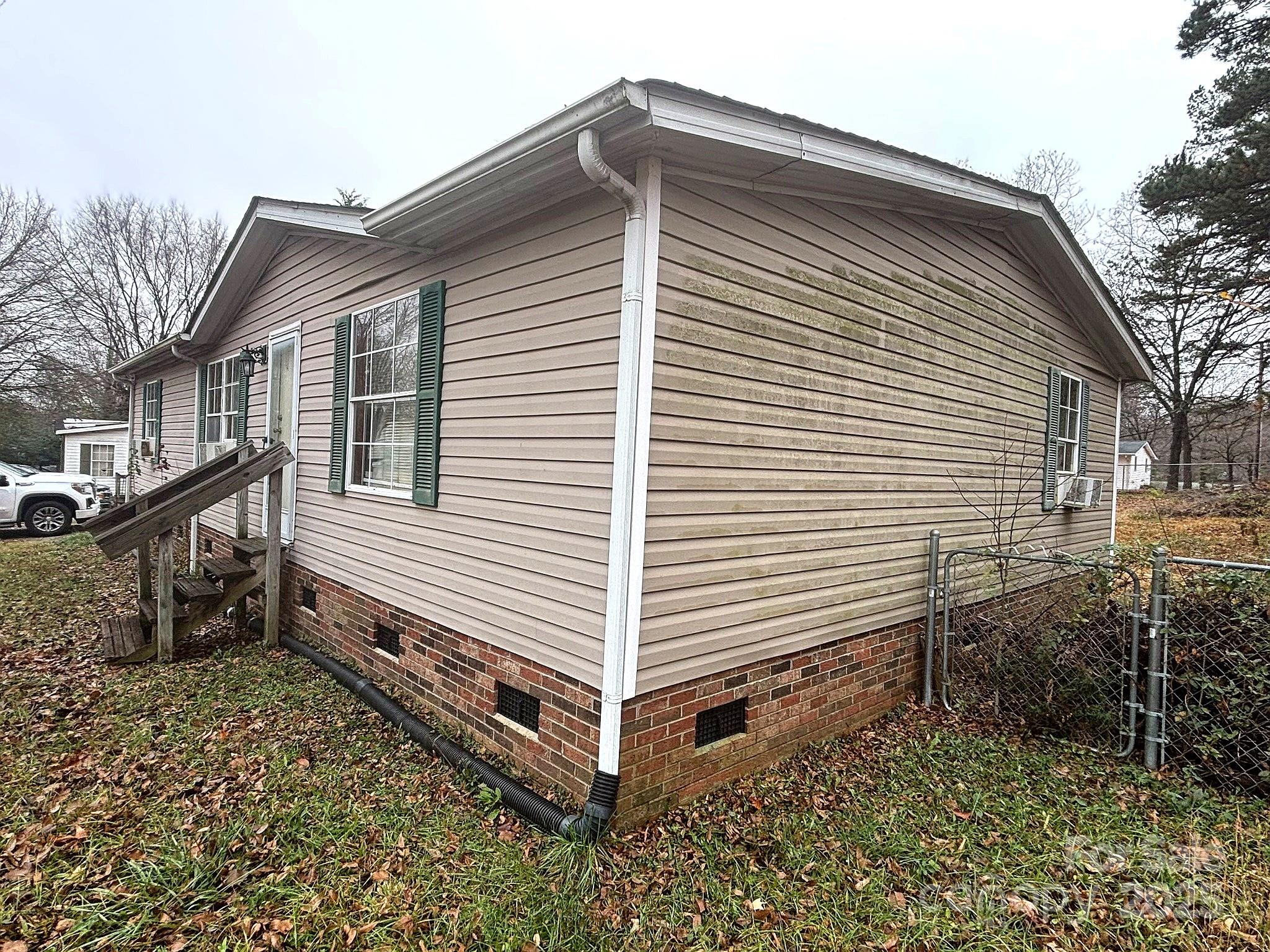 212 South Upright Street Landis, NC 28088 - Photo 2 of 21 a view of a house with a yard and stairs