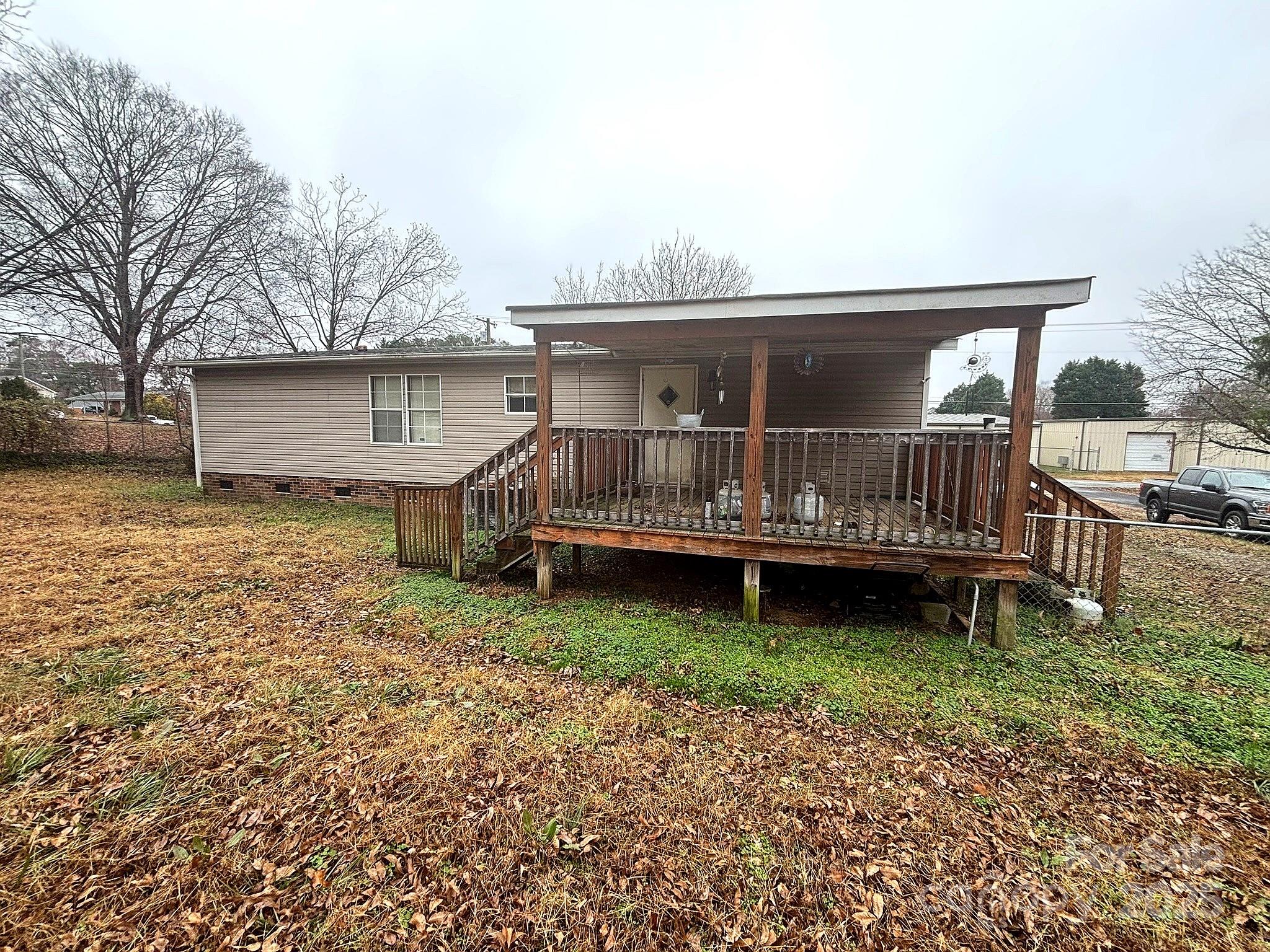 212 South Upright Street Landis, NC 28088 - Photo 4 of 21 a view of a house with a yard and sitting area