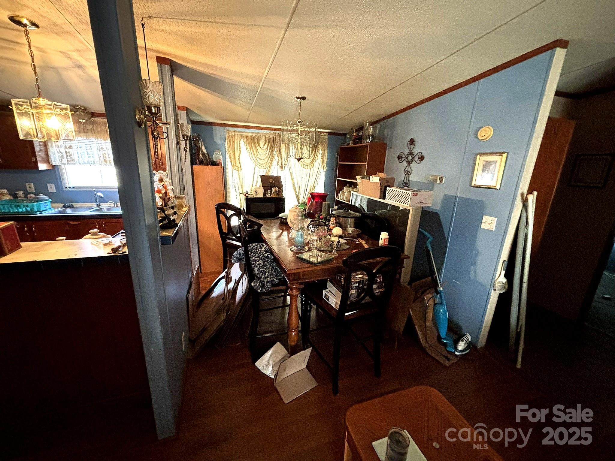212 South Upright Street Landis, NC 28088 - Photo 9 of 21 a view of a dining room with furniture window and wooden floor