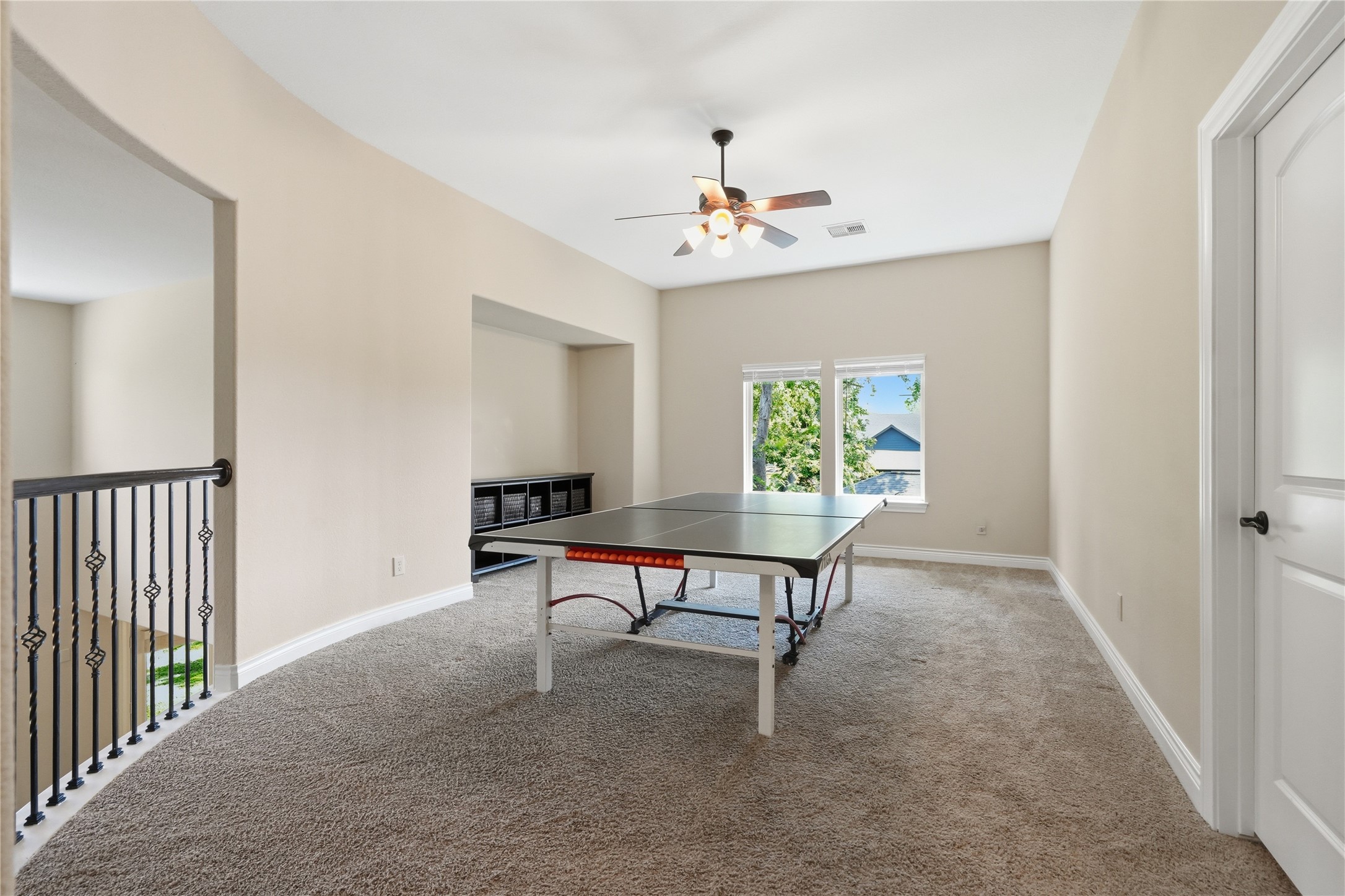 6429 Remlap Street Houston, TX 77055 - Photo 18 of 30 Versatile game/play area perfect for ping-pong, media, or homework zones, all set in a bright upstairs space.