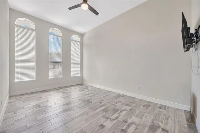 a kitchen with granite countertop white cabinets and stainless steel appliances