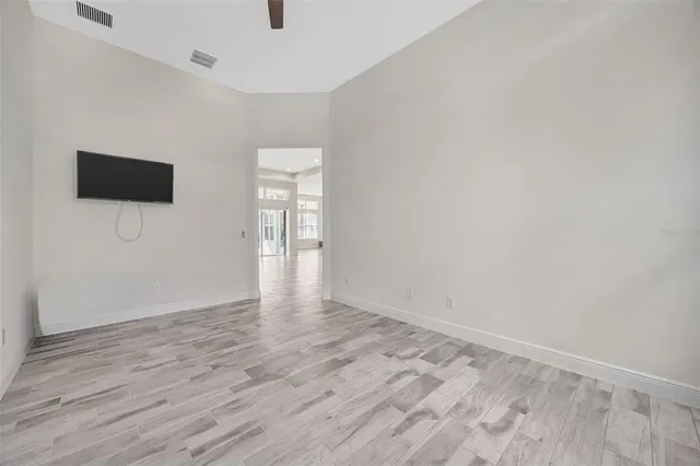 a view of an empty room with a window