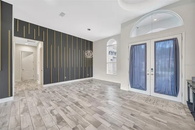 a kitchen with kitchen island white cabinets and white appliances