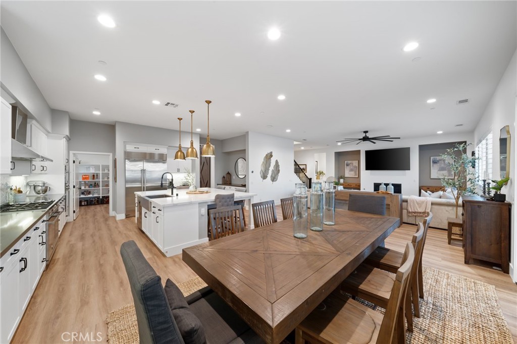 17042 Meteor Way Riverside, CA 92503 - Photo 15 of 75 a large kitchen with a table and chairs in it